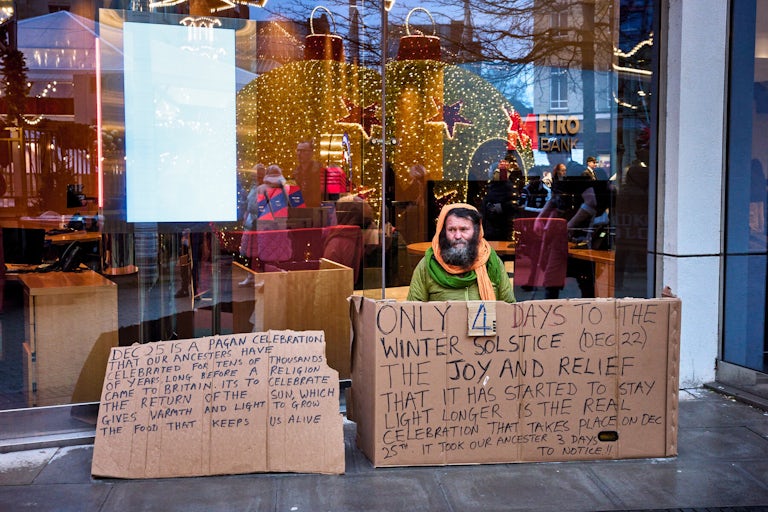Michael with his annual festive message, Broadmead, Bristol, December 2023. Photograph Copyright © Simon Holliday