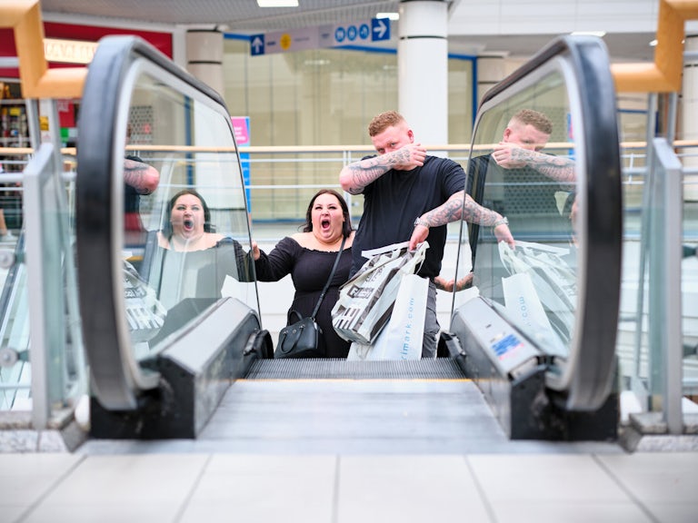 Escalator Faces; The Galleries Shopping Centre, Broadmead, Bristol, August 2024. Photograph Copyright © Simon Holliday